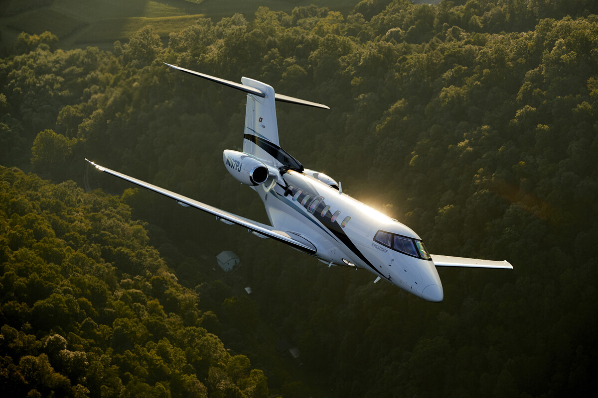 Pilatus PC24 flying over the forest