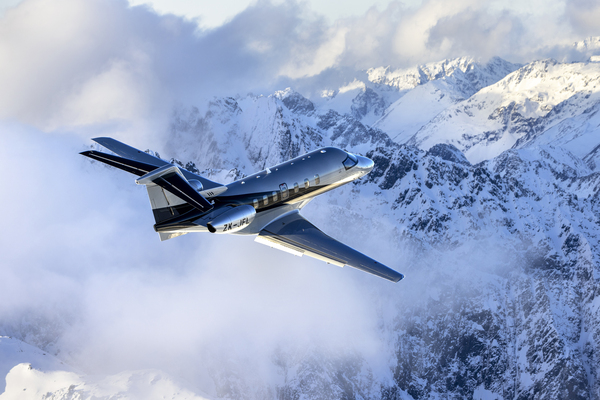 Pilatus PC24 flying over the snow mountains